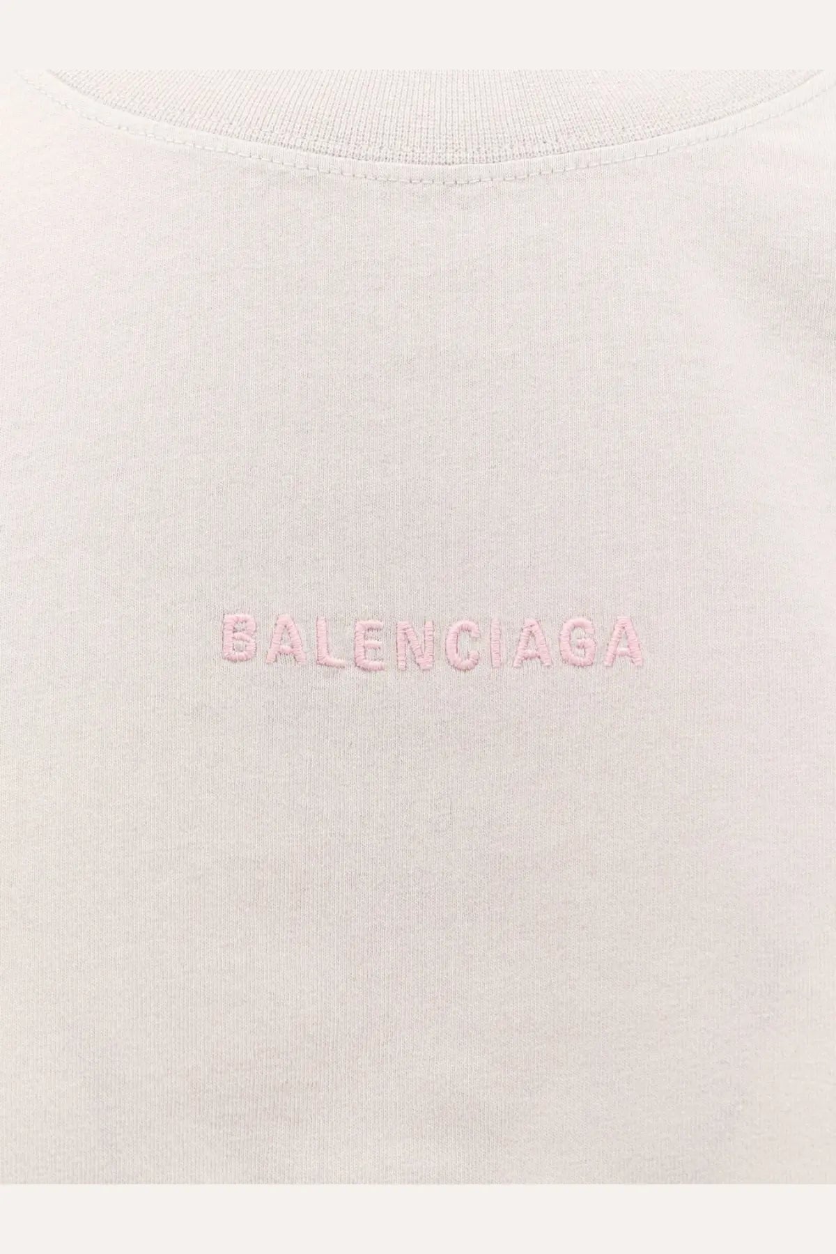Balenciaga women’s off-white cotton t-shirt with a subtle pink embroidered logo across the chest