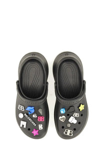 Balenciaga women’s black crocs clogs adorned with colorful branded charms and decorative accessories