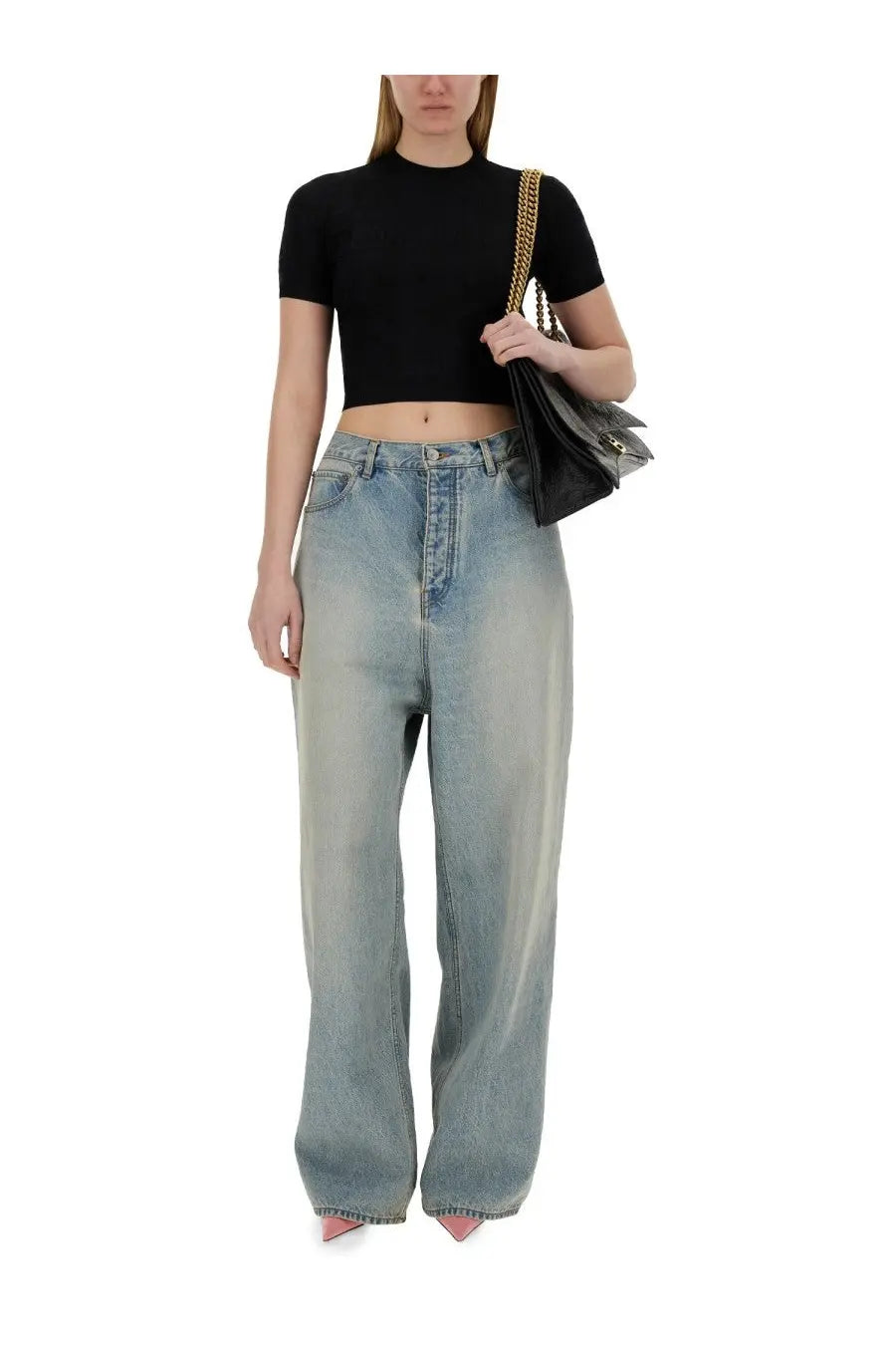 High-waisted light blue denim jeans with faded wash and straight-leg cut paired with balenciaga women’s black cropped shirt