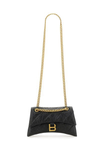 Balenciaga women’s crush small black quilted leather crossbody bag with gold-tone chain strap and prominent b logo clasp