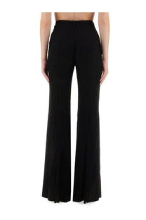 Balenciaga women’s black high-waisted flared pants with tailored fit and subtle side slits