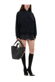 Black leather balenciaga shopping bag with top handles and front logo patch for balenciaga women’s flipped zippered sweatshirt black