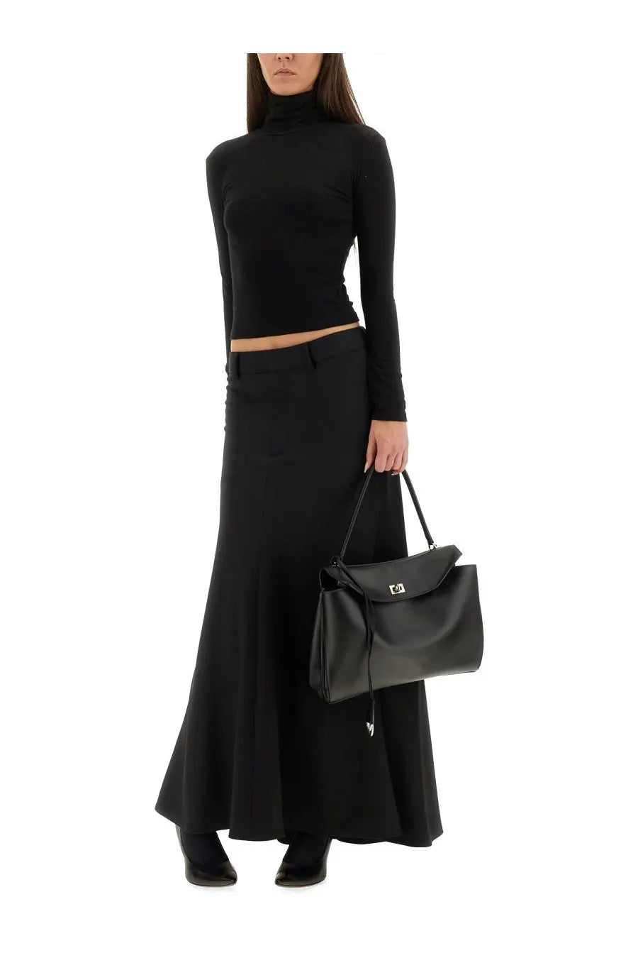 Black leather handbag with silver tone clasp and drawstring detail paired with Balenciaga godet maxi skirt black