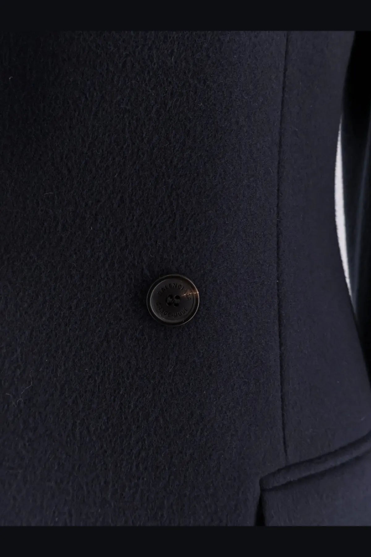 Dark navy wool coat button with subtle metallic sheen and embossed logo on balenciaga women’s godet midi double breasted coat