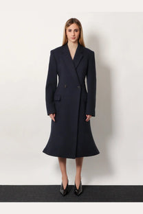 Balenciaga women’s navy blue wool double breasted coat with structured silhouette and flared midi hem