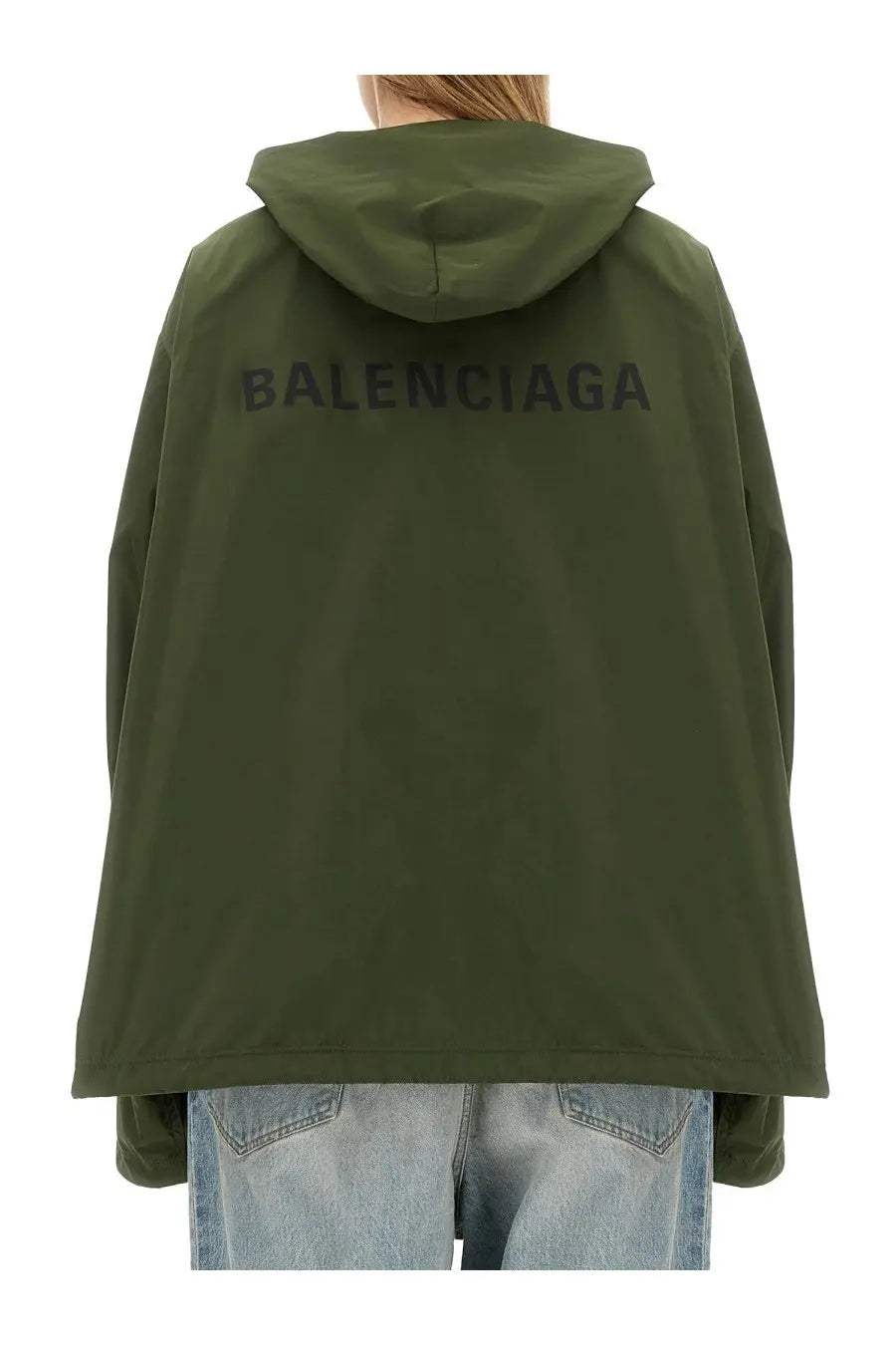 Back side of olive green balenciaga women’s hooded jacket with logo print across the back