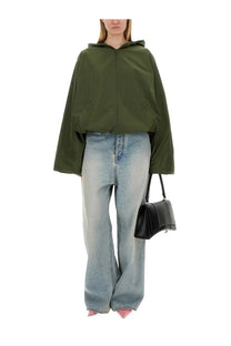 Balenciaga women’s olive green hooded jacket with front zipper and wide sleeves in a lightweight fabric
