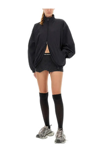Balenciaga women’s black jacket with oversized silhouette and front zipper detail in sleek material