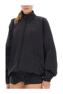 Balenciaga women’s black oversized zip-up jacket with high collar and relaxed fit in soft material