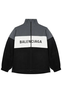Balenciaga women’s color-blocked track jacket in black gray and white with bold logo across the chest