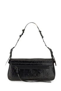 Balenciaga women’s le cagole small shoulder bag in black patent leather with glossy textured surface and adjustable strap