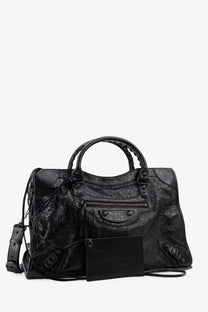 Balenciaga women’s le city medium leather handbag in black with distressed leather and metal hardware details