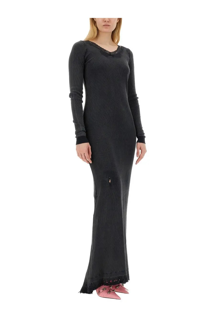 Balenciaga women’s black ribbed long-sleeved dress with lace trim at neckline and hem worn with pink shoes