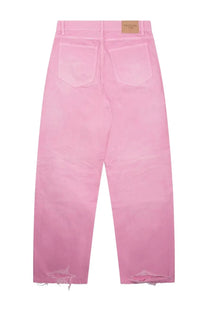 Balenciaga women’s loose fit pink denim jeans with frayed cuffs and beige brand label at the waistband