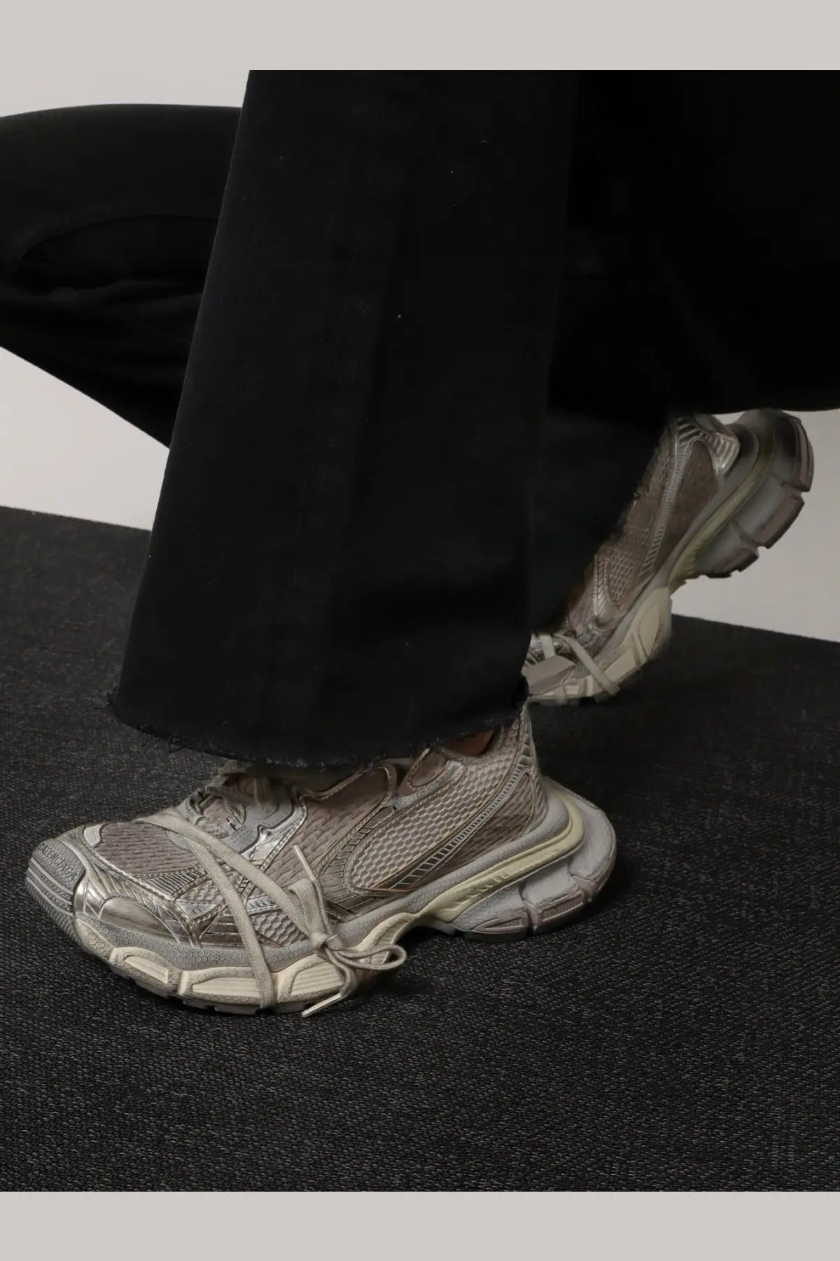 Balenciaga women’s low top white mesh sneakers with gray chunky layered sole and intricately tied laces