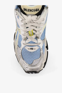 Balenciaga women’s low top runner mesh sneakers with light blue upper silver metallic accents and white laces with yellow stripe