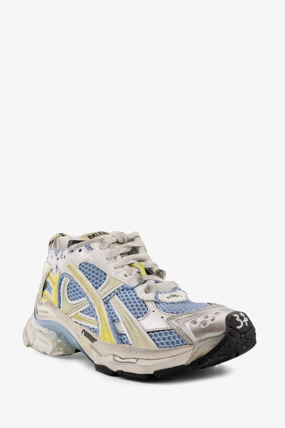 Balenciaga women’s low top runner mesh sneakers in distressed white blue and yellow with metallic silver overlays