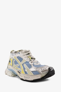 Balenciaga women’s low top runner mesh sneakers in distressed white blue and yellow with metallic silver overlays