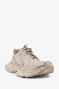 Cream-colored Balenciaga women’s mesh sneakers with textured upper and chunky rubber sole in beige