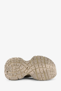 Beige rubber sole with textured grid tread on Balenciaga women’s mesh sneakers for stylish comfort and durability