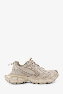 Beige balenciaga women’s mesh sneakers with textured upper and chunky rubber sole for stylish casual wear