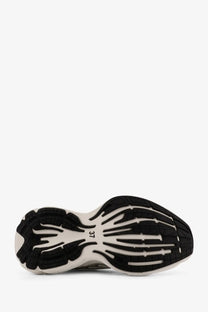 Black and white textured sole of balenciaga women’s monday low top leather sneakers in white