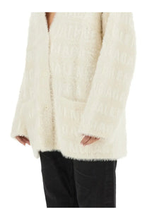 Balenciaga women’s cream-colored fluffy knit cardigan with textured pattern and button closure in white