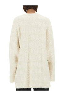 Balenciaga women’s cream-colored fluffy knit cardigan with long sleeves and a soft textured surface