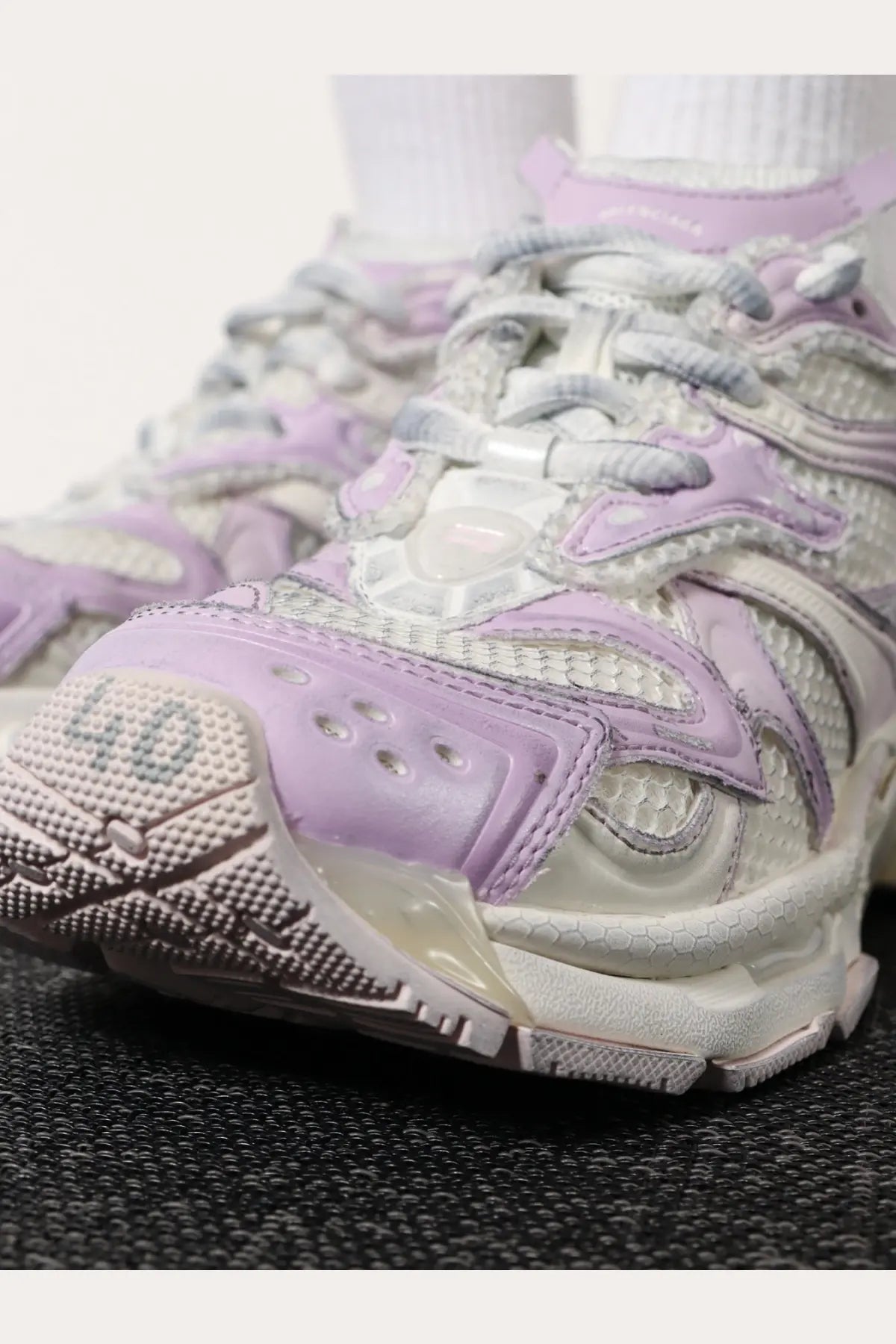 Balenciaga women’s nylon and mesh runner sneaker in pale lavender and white with chunky textured layered design