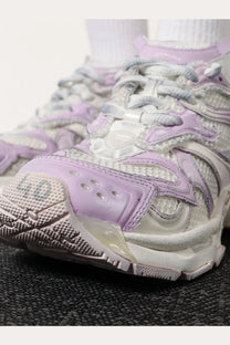 Balenciaga women’s nylon and mesh runner sneaker in pale lavender and white with chunky textured layered design