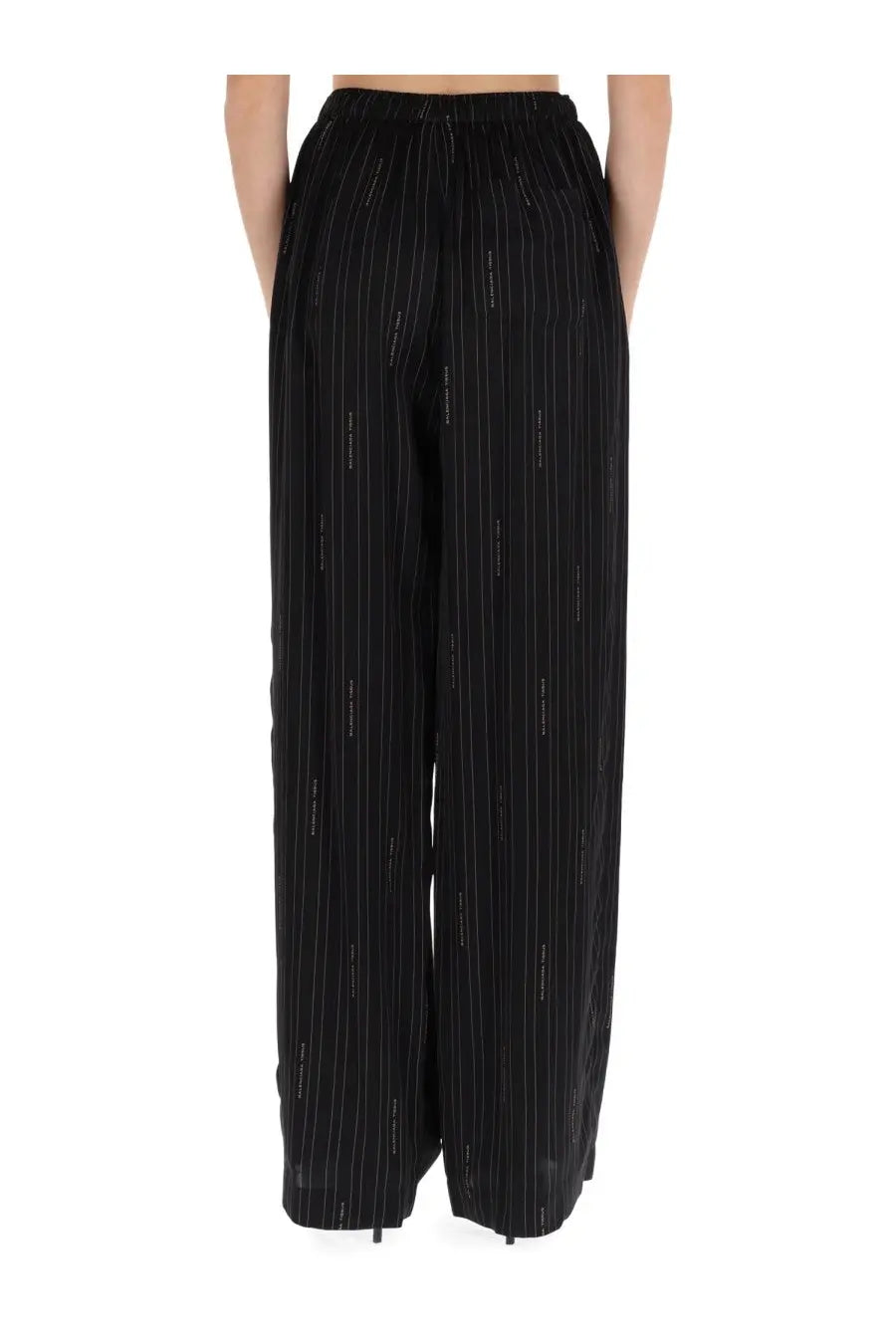 Balenciaga women’s black pyjama pants with wide-leg fit subtle vertical pinstripes and stretchy elastic waistband