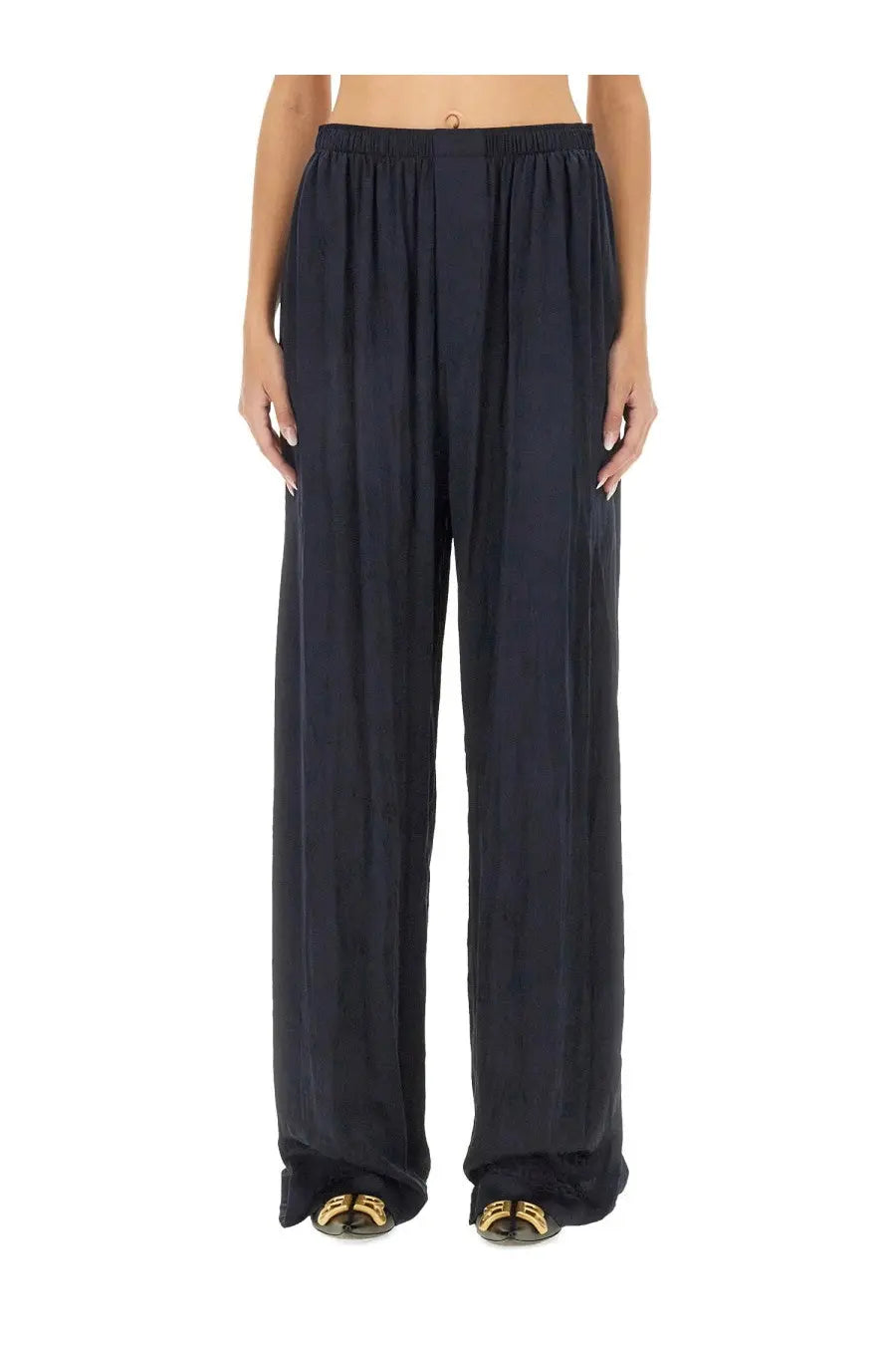 Balenciaga women’s black wide-leg trousers with relaxed flowing silhouette and elastic waistband in pyjama style