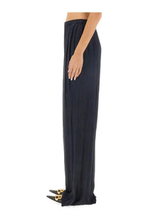 Balenciaga women’s black wide-leg trousers with soft flowing fabric and elastic waistband in pyjama style