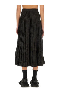 Balenciaga women’s black pleated midi skirt with textured crinkled fabric and subtle vertical ribbing