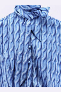 Balenciaga women’s long blue printed fabric dress with textured cable knit blouse and matching tied neck scarf