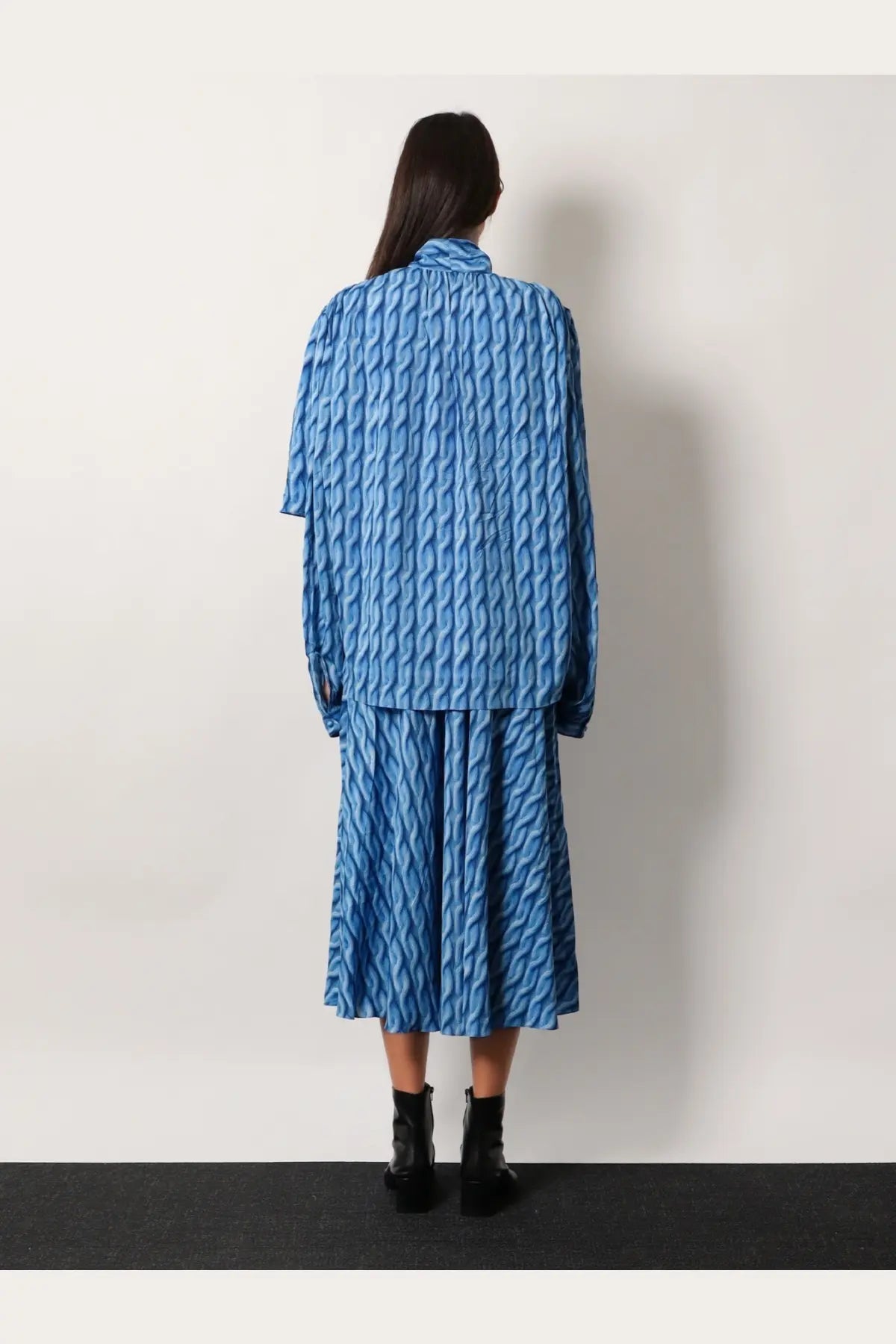 Balenciaga women’s blue printed fabric two-piece outfit with textured wavy design on top and skirt