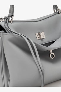 Balenciaga women’s rodeo leather crossbody bag in light gray with silver hardware and drawstring closure