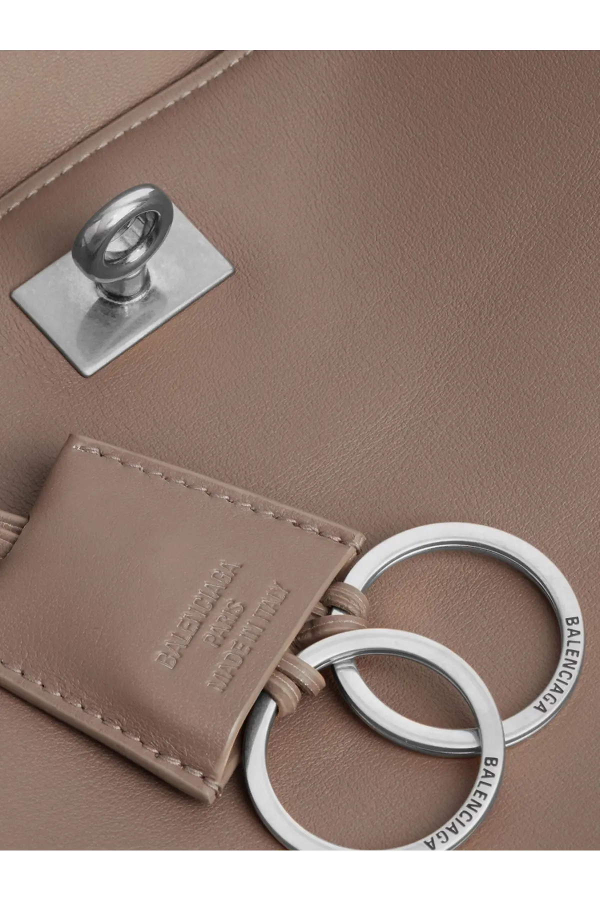 Beige leather key ring with silver-toned metal rings and a balenciaga paris made in italy embossed tag