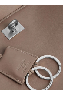 Beige leather key ring with silver-toned metal rings and a balenciaga paris made in italy embossed tag