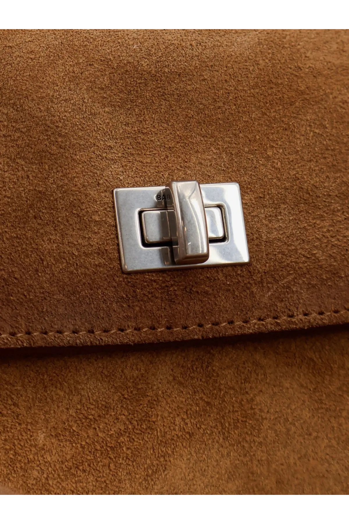 Balenciaga women’s rodeo suede shoulder bag beige with a sleek silver-toned rectangular clasp on brown suede surface