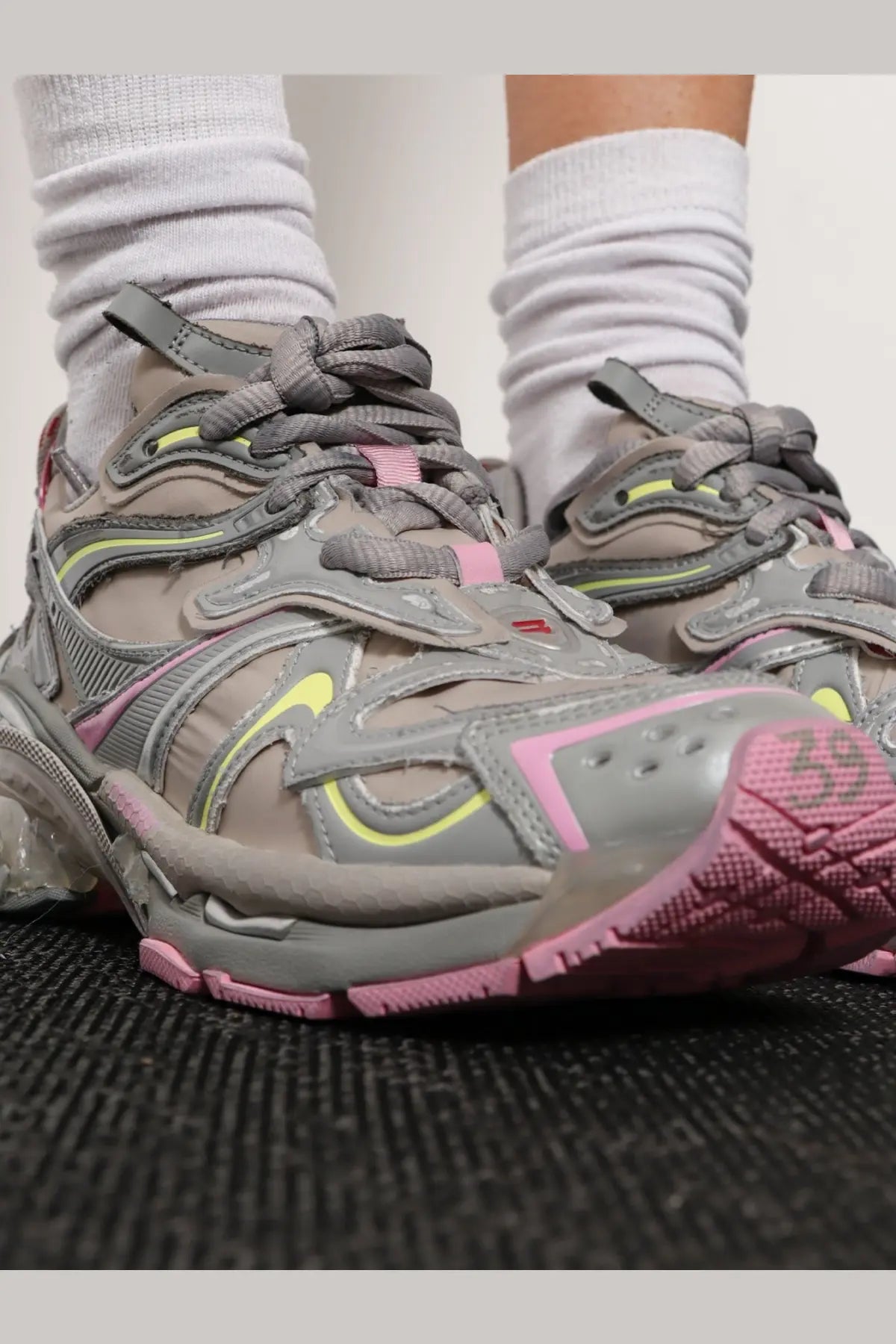 Balenciaga women’s runner nylon low top sneakers in gray and pink with neon yellow accents and triple s design