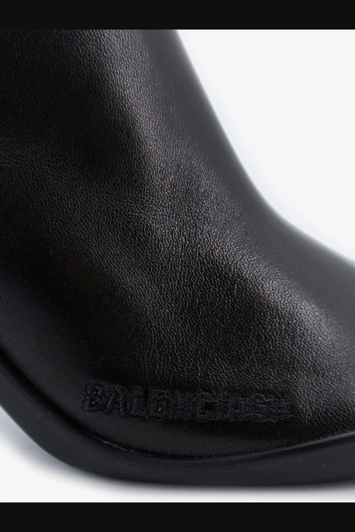 Balenciaga women’s Shibuya black leather boot with embossed branding on the side for stylish urban wear