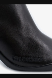 Balenciaga women’s Shibuya black leather boot with embossed branding on the side for stylish urban wear