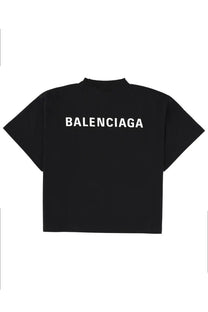Balenciaga women’s black t-shirt showing the back with bold white lettering across the cotton fabric