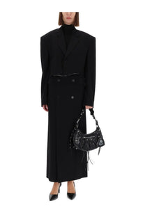 Balenciaga women’s single breasted cut off jacket black paired with black leather balenciaga moon bag with fringed detailing and studs
