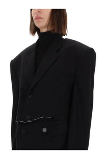 Balenciaga women’s black single breasted cut off blazer with exaggerated shoulders and white stitched hem detail