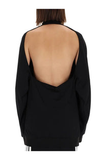 Balenciaga women’s black oversized sweatshirt showing back with deep cutout and ribbed cuffs design