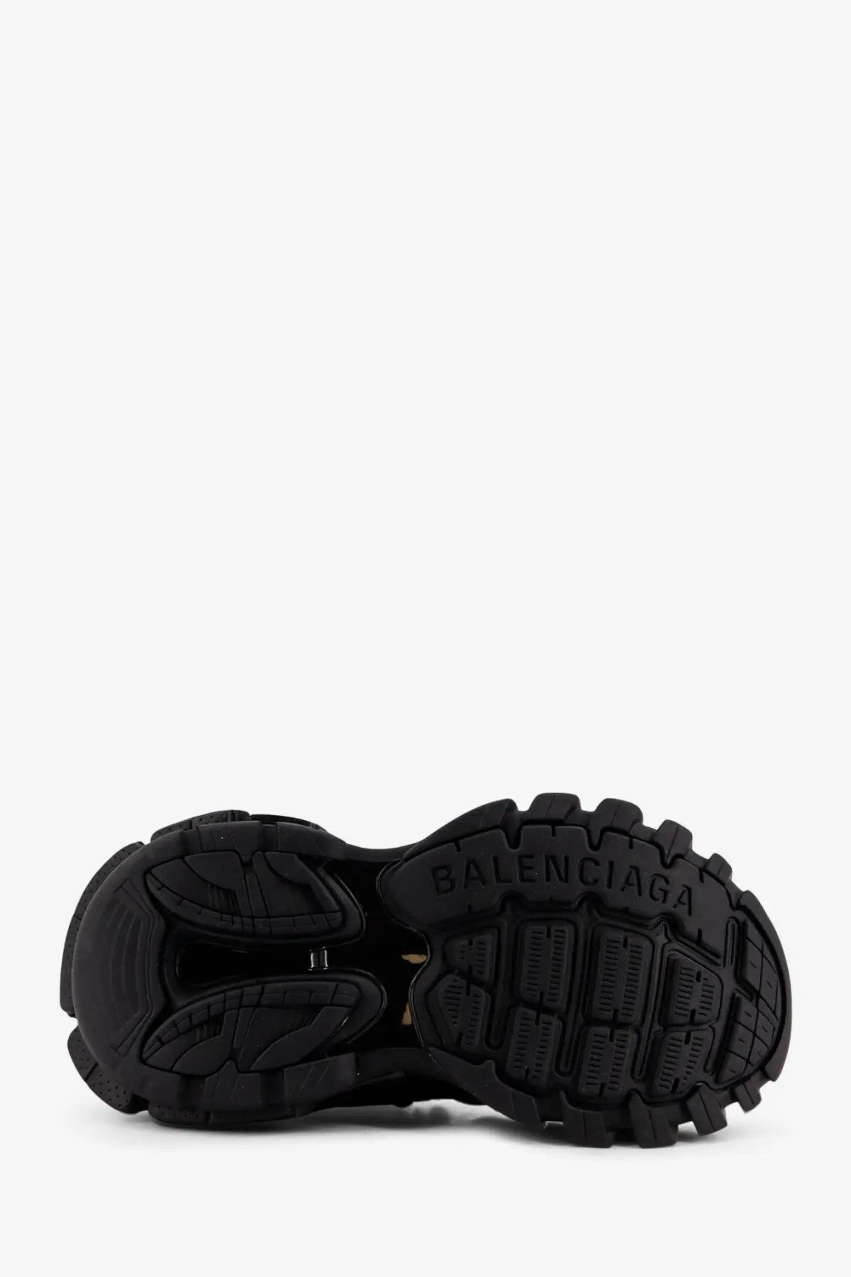 Black rubber sole of balenciaga women’s track mesh sneakers with bold chunky tread and embossed brand logo