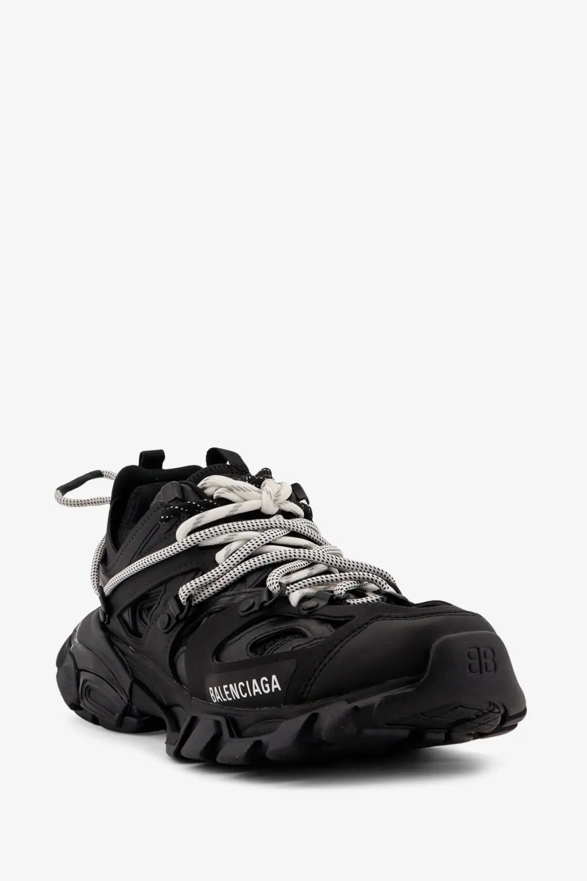 Balenciaga women’s track mesh sneakers black with textured upper and chunky rubber sole in a side view