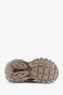Tan rubber sole of balenciaga women’s track mesh sneakers with bold chunky tread and embossed brand logo